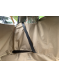 Fastening the car seatbelt in a dog seat cover with side flaps